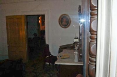 Shadow Figure Sitting in Doorway